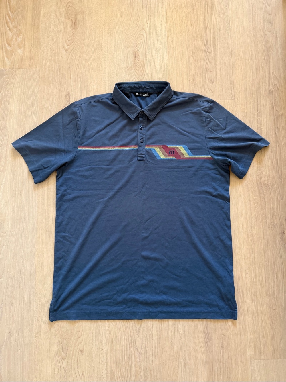 Travis Matthew Men's Navy Polo Shirt with Multicolor Stripe
